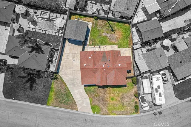 a view of house with yard and green space