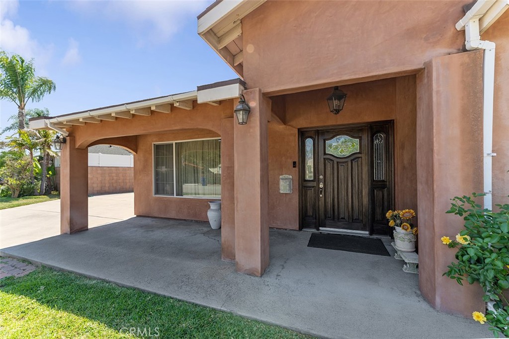 5441 North Calera Avenue Covina, CA 91722 - Photo 5 of 32 a front view of a house with a porch