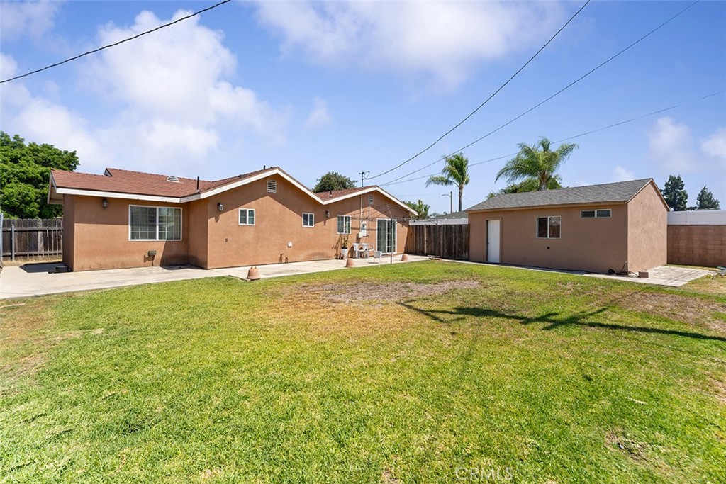 5441 North Calera Avenue Covina, CA 91722 - Photo 6 of 32 a front view of a house with a garden and yard
