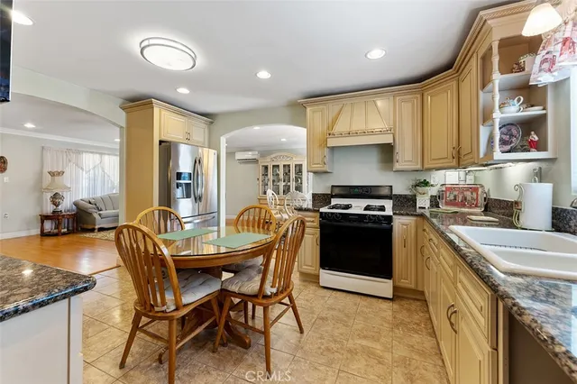 a kitchen with a stove a sink and a refrigerator