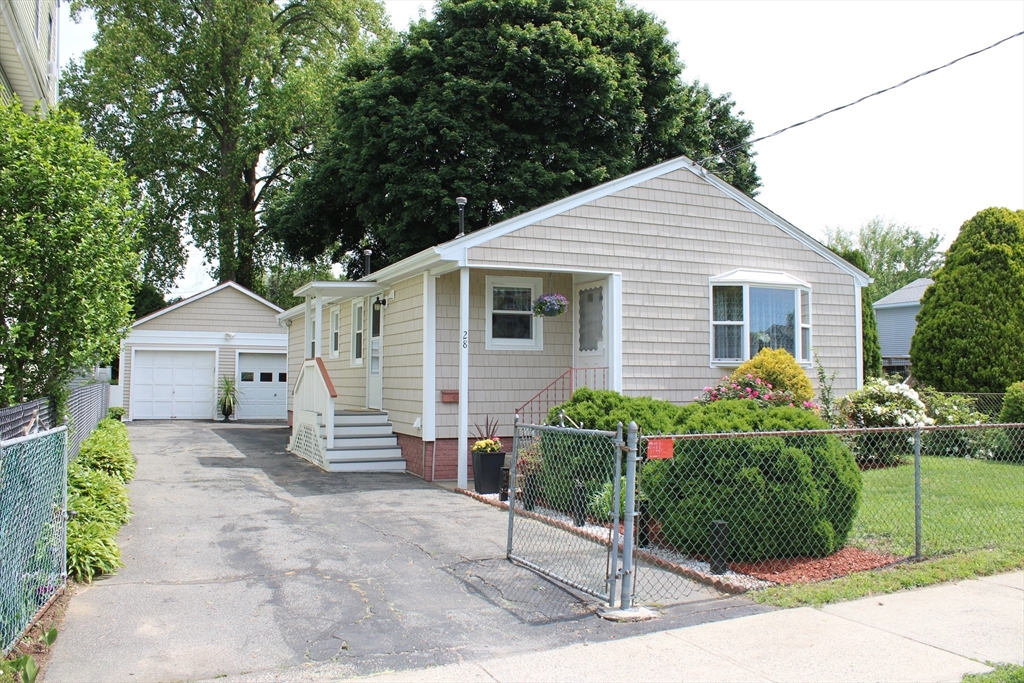 28 State Street Chicopee, MA 01013 - Photo 1 of 25 a front view of a house with a garden