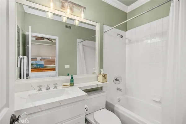 a bathroom with a toilet a sink and a bathtub