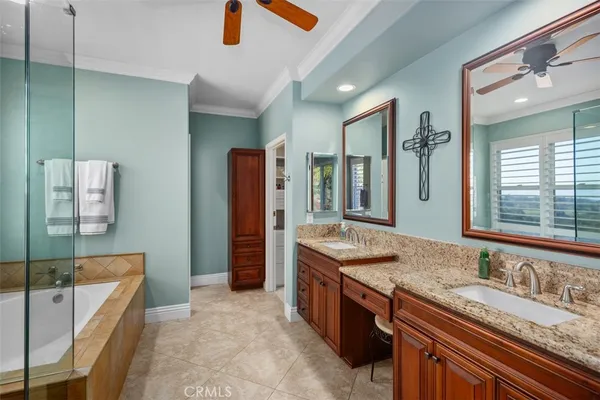 a bathroom with a granite countertop sink mirror and double
