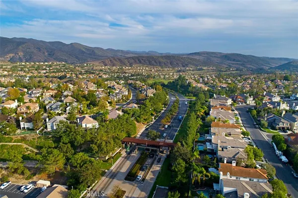 a view of a city with mountains in the background