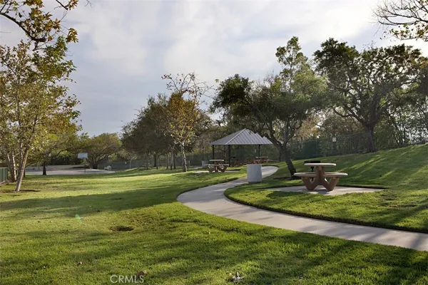 a view of outdoor space with playground and green space