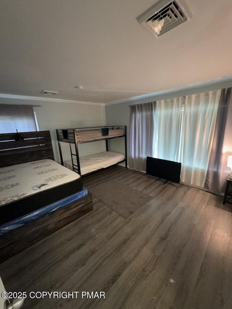 5228 Hummingbird Drive Pocono Summit, PA 18346 - Photo 15 of 28 a view of room with hardwood floor and ceiling fan