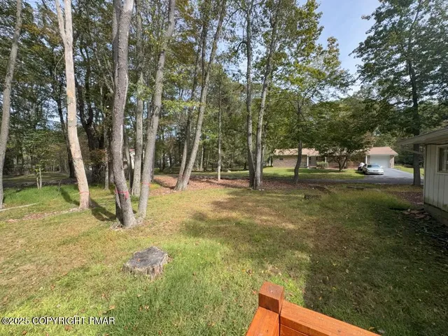 a backyard of a house with lots of green space
