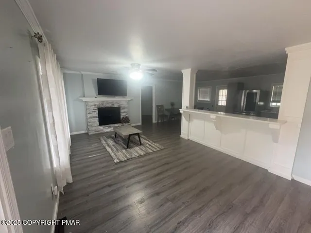 a kitchen with sink cabinets and wooden floor