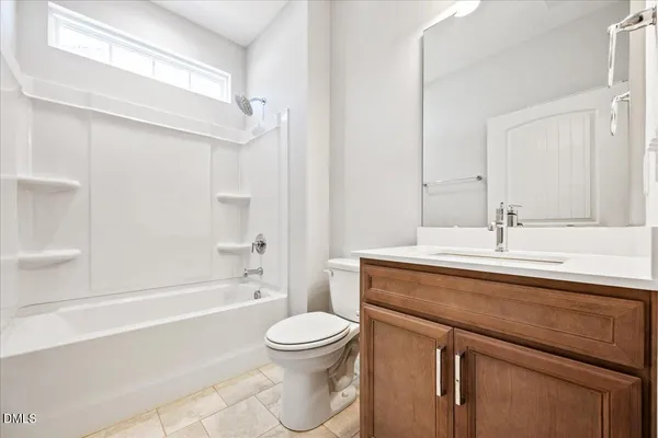 a bathroom with a sink a toilet and a bathtub