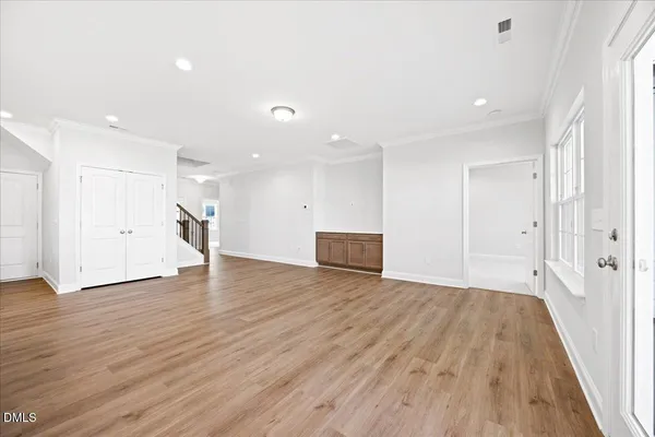 a view of a livingroom with wooden floor