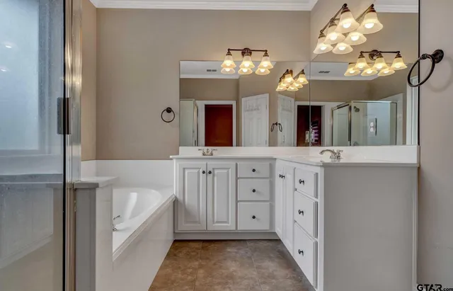 a bathroom with a double vanity sink and a mirror