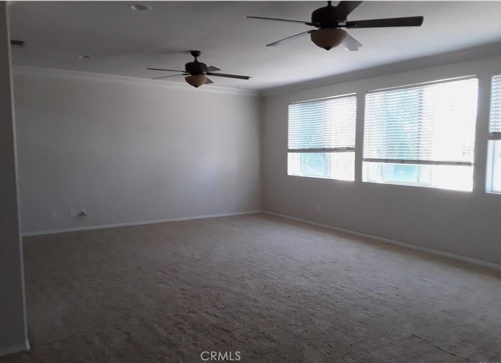 12701 Palm View Way Riverside, CA 92503 - Photo 24 of 26 an empty room with a window and a ceiling fan