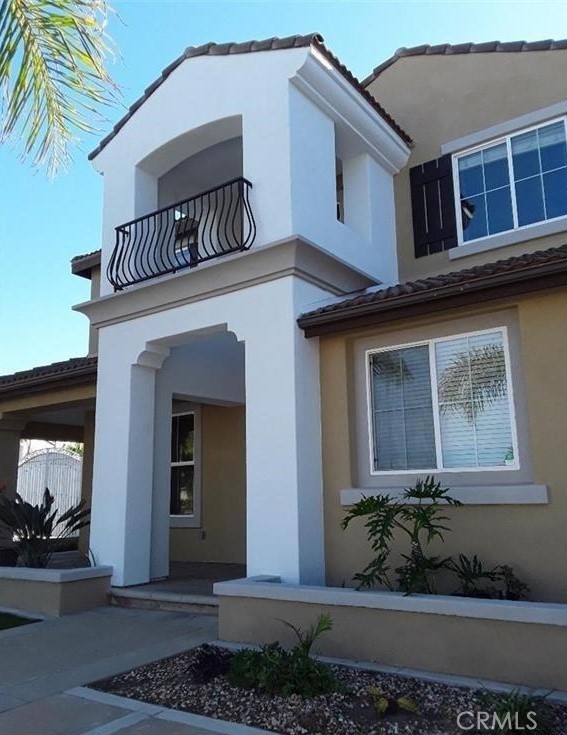 12701 Palm View Way Riverside, CA 92503 - Photo 8 of 26 a front view of a house with a yard