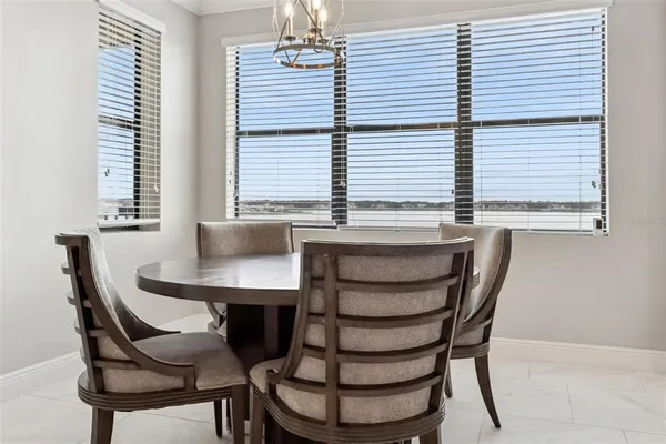 a view of a dining room with furniture and window