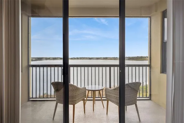a view of a room with a table and chairs