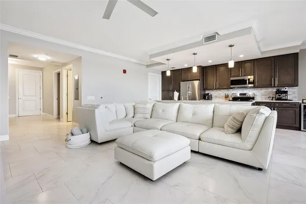 a living room with furniture white walls and white walls