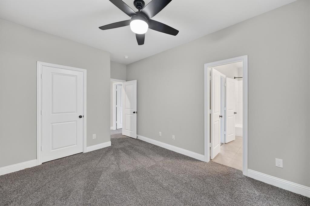 4224 Riverside Drive Flower Mound, TX 75028 - Photo 12 of 23 an empty room with chandelier fan and closet area