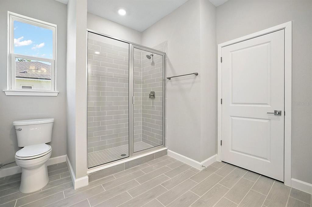 13401 Southwest 77th Court Ocala, FL 34473 - Photo 15 of 20 a bathroom with a shower and a toilet
