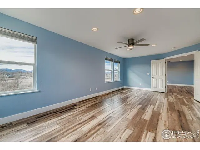 a view of an empty room and window