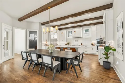 a kitchen with stainless steel appliances a stove a sink and cabinets