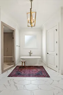 a bedroom with a large bed and a large window