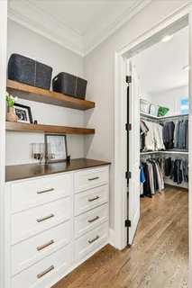 a bedroom with a bed and a book shelf