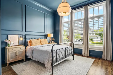a kitchen with stainless steel appliances a stove a sink and a white cabinets