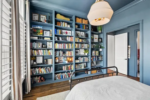 a kitchen with stainless steel appliances a cabinets and a table