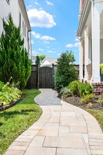 a view of backyard with swimming pool and outdoor seating