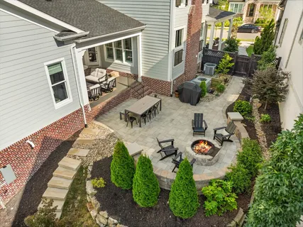 a view of backyard with patio