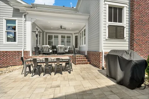 a front view of a house with a garden and yard