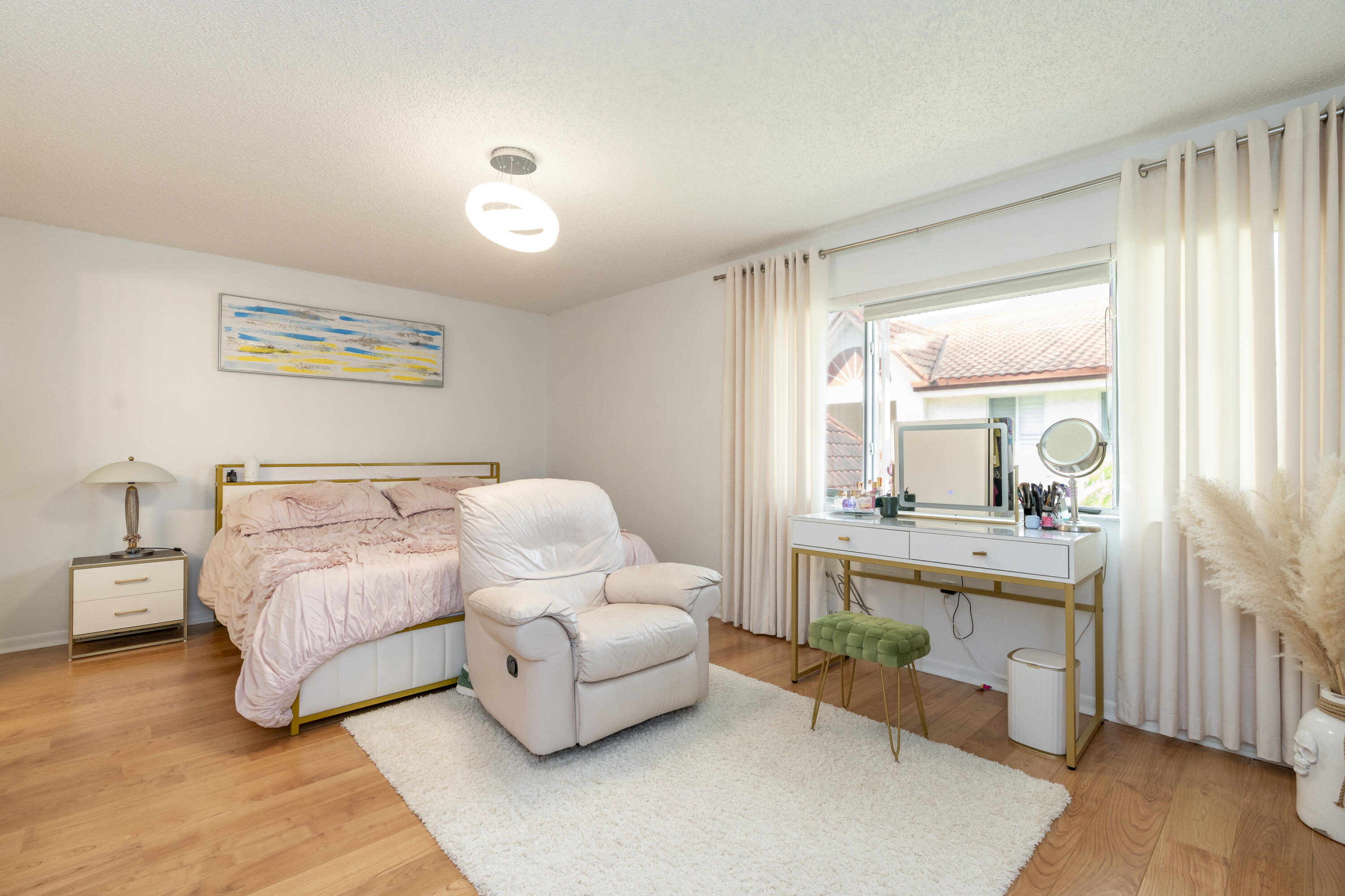 106 Half Moon Circle, Unit H2 Hypoluxo, FL 33462 - Photo 19 of 70 a bedroom with a bed and a large window