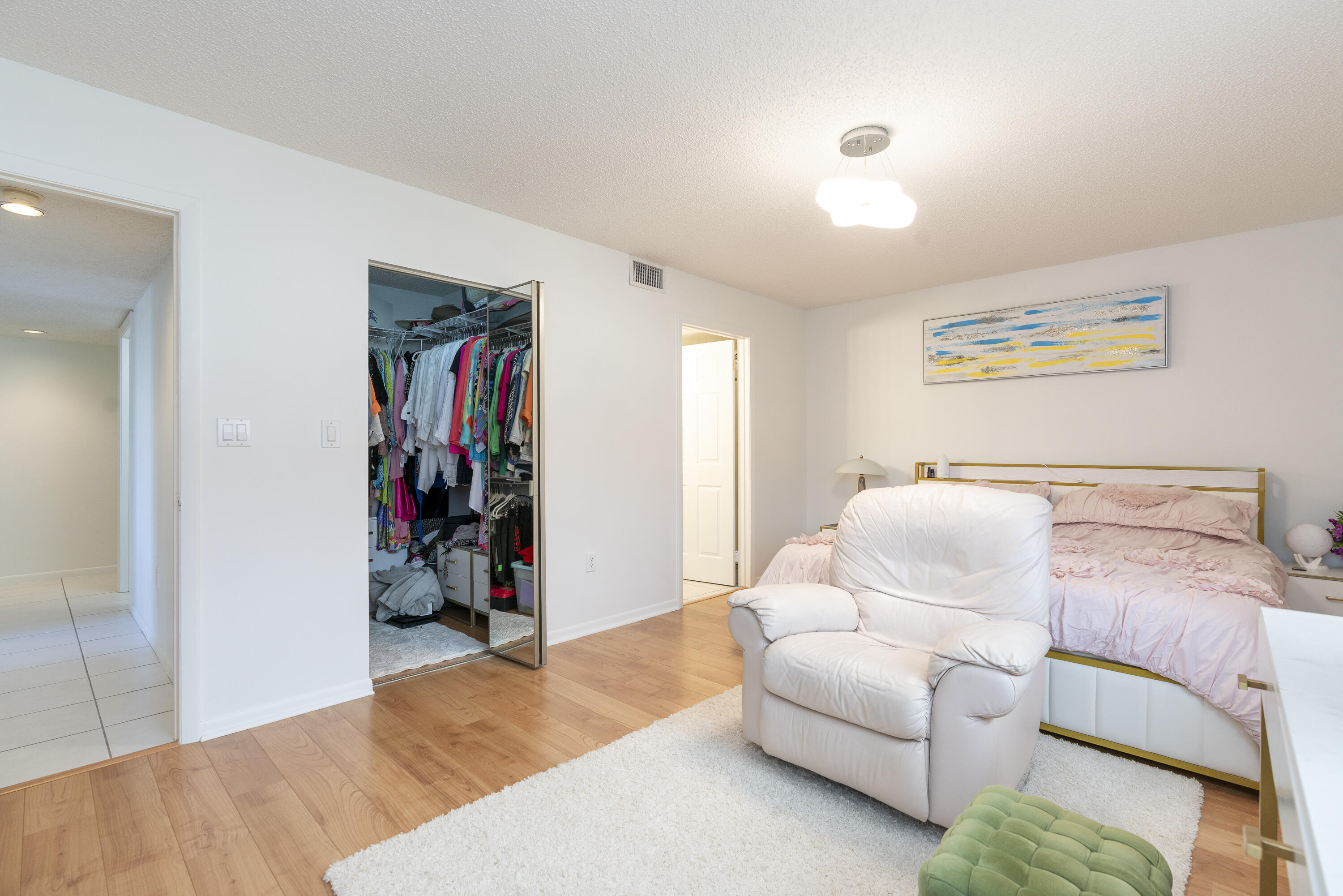 106 Half Moon Circle, Unit H2 Hypoluxo, FL 33462 - Photo 21 of 70 a bedroom with bed and a couch