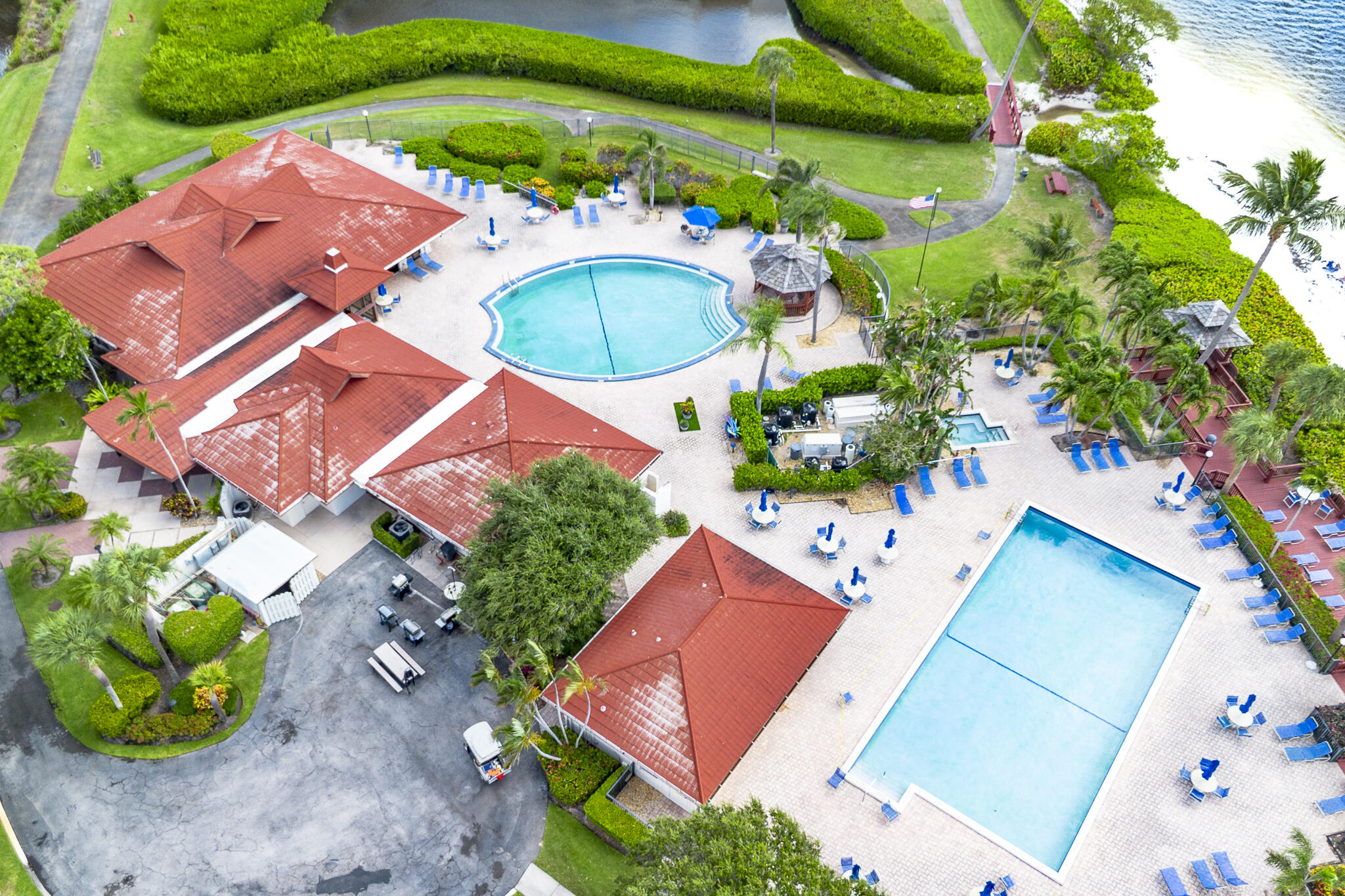 106 Half Moon Circle, Unit H2 Hypoluxo, FL 33462 - Photo 38 of 70 an aerial view of a house with a swimming pool yard and outdoor seating