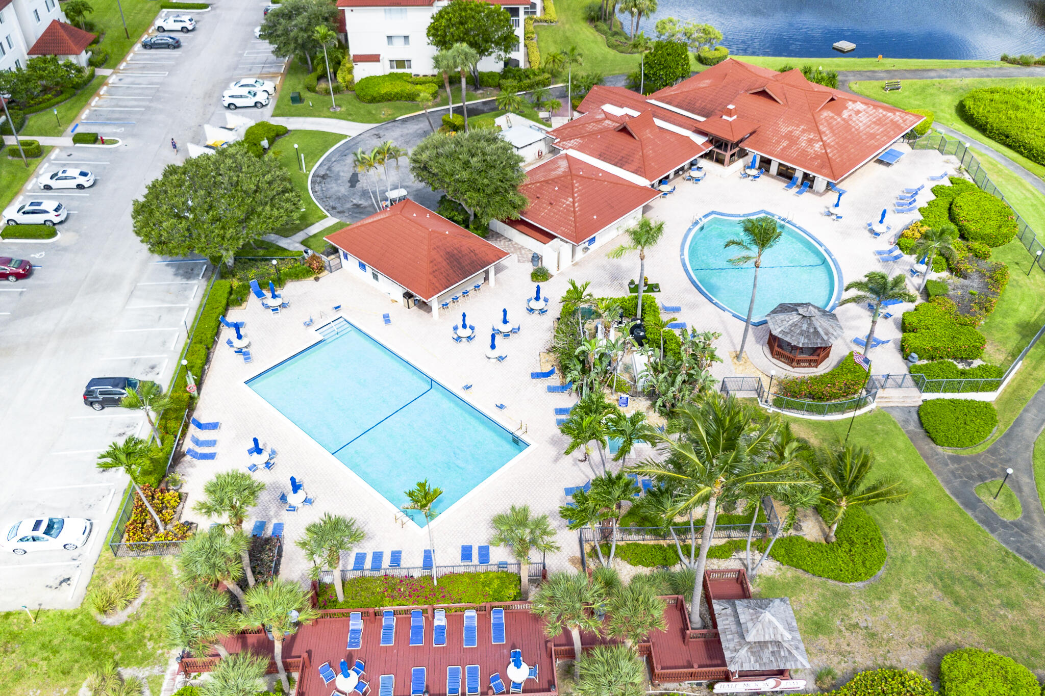 106 Half Moon Circle, Unit H2 Hypoluxo, FL 33462 - Photo 42 of 70 an aerial view of a tennis ground and a yard