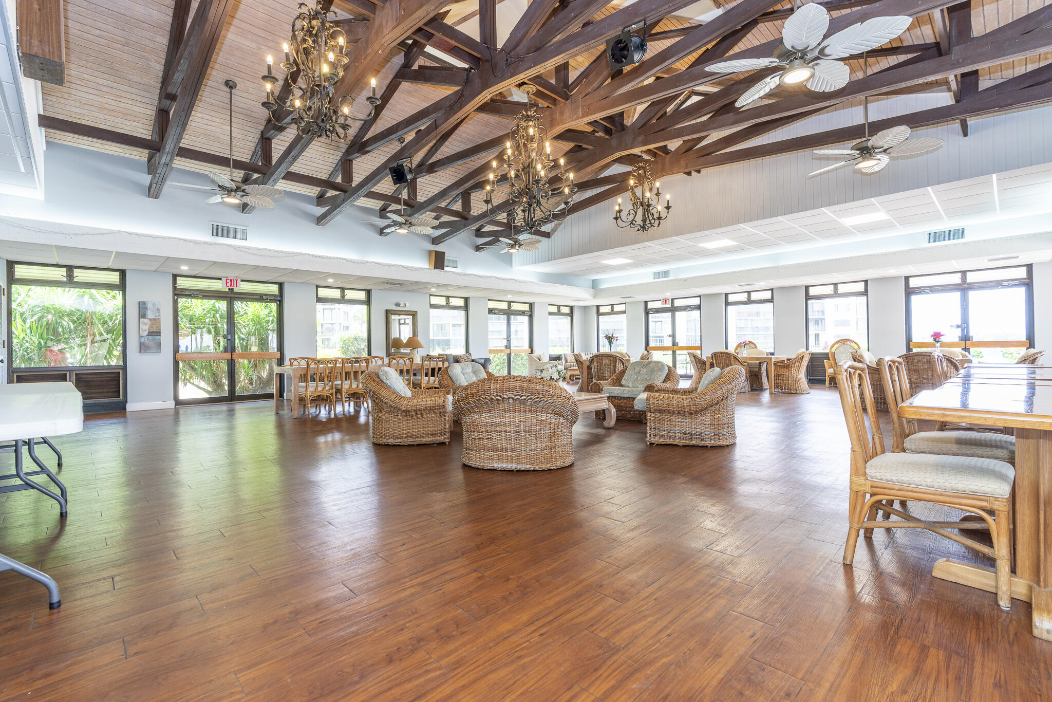 106 Half Moon Circle, Unit H2 Hypoluxo, FL 33462 - Photo 46 of 70 a living room with lots of furniture wooden floor and a table