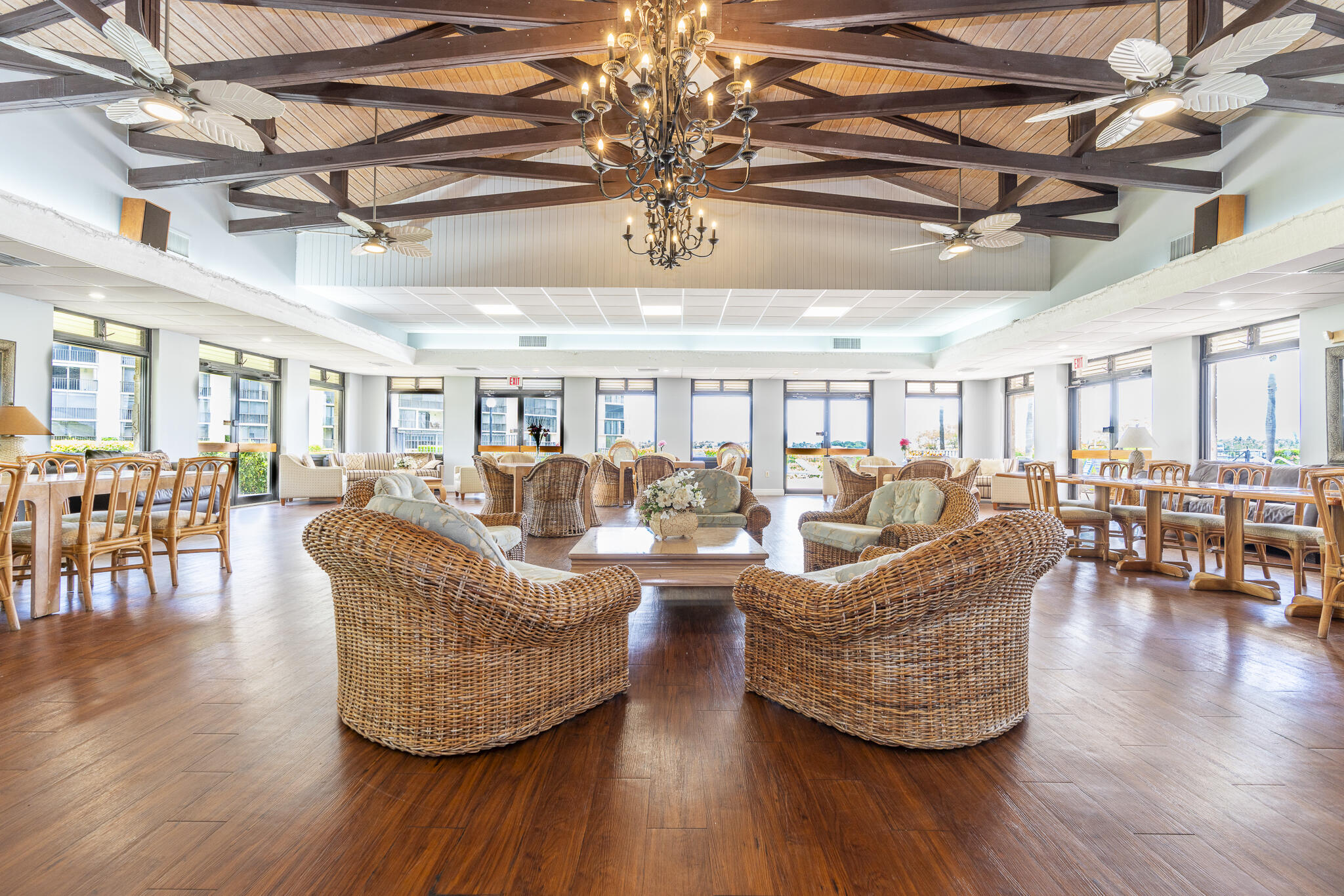 106 Half Moon Circle, Unit H2 Hypoluxo, FL 33462 - Photo 47 of 70 a living room with lots of furniture and wooden floors