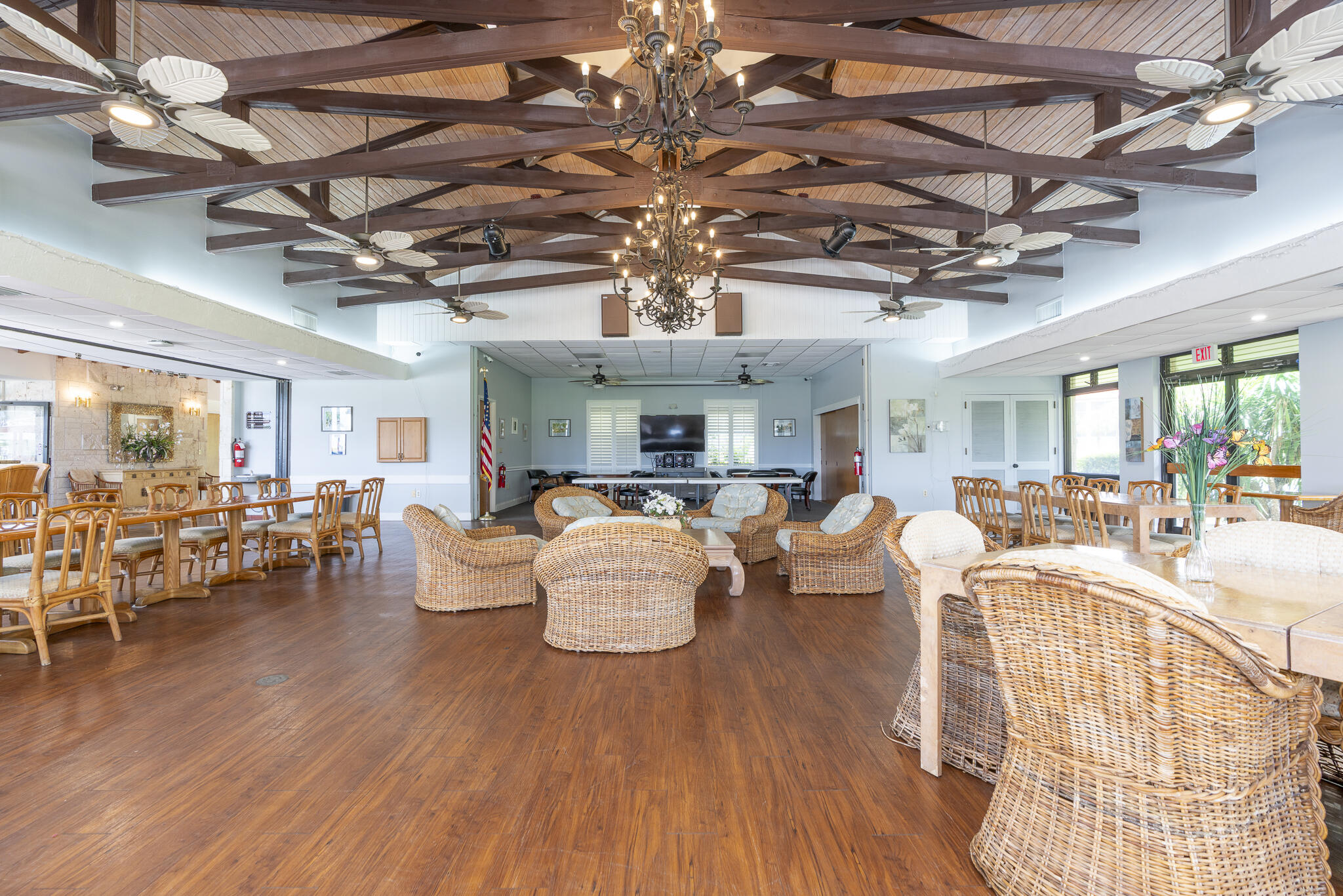 106 Half Moon Circle, Unit H2 Hypoluxo, FL 33462 - Photo 49 of 70 a living room with lots of furniture and chandelier