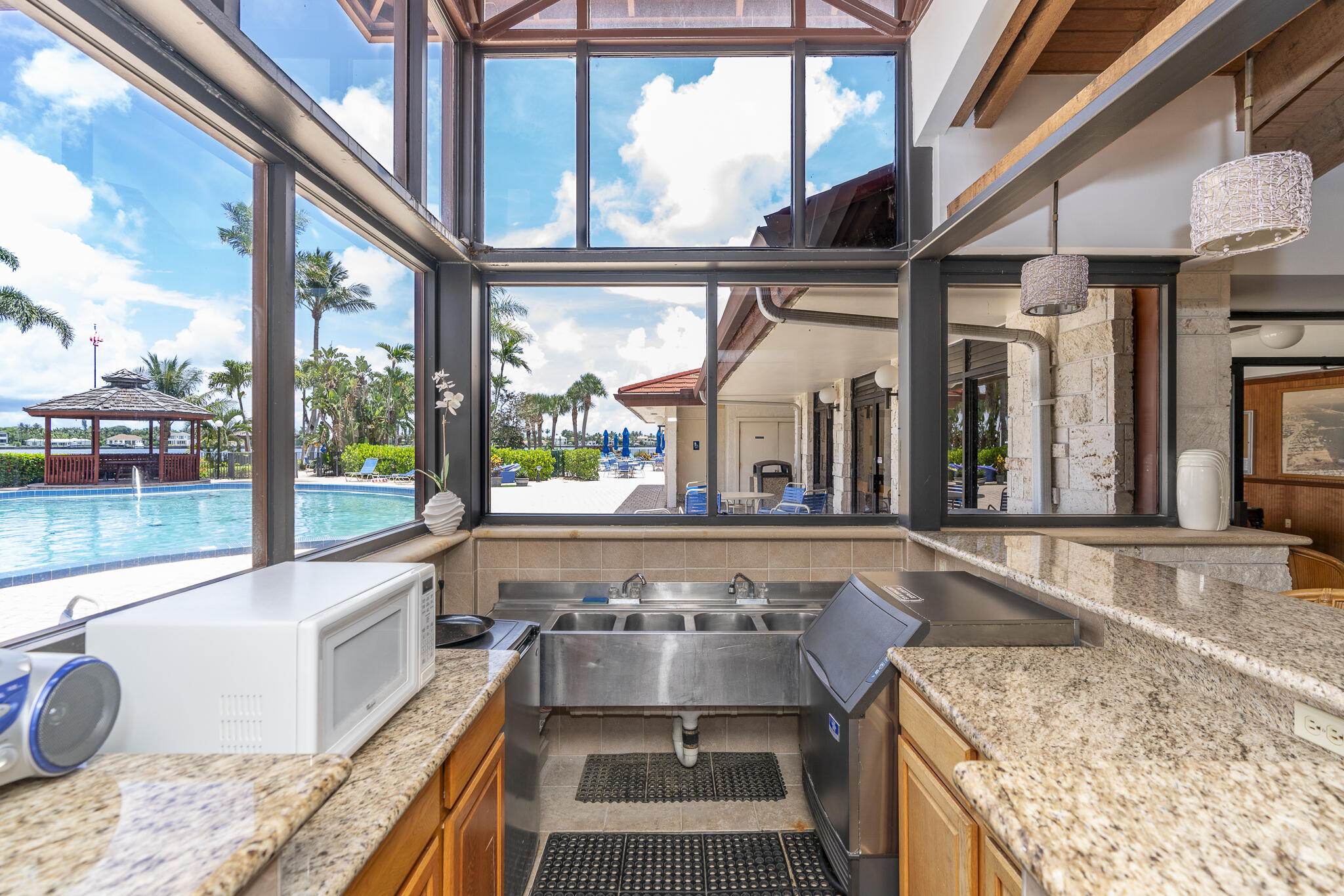 106 Half Moon Circle, Unit H2 Hypoluxo, FL 33462 - Photo 51 of 70 a view of a kitchen with a large window
