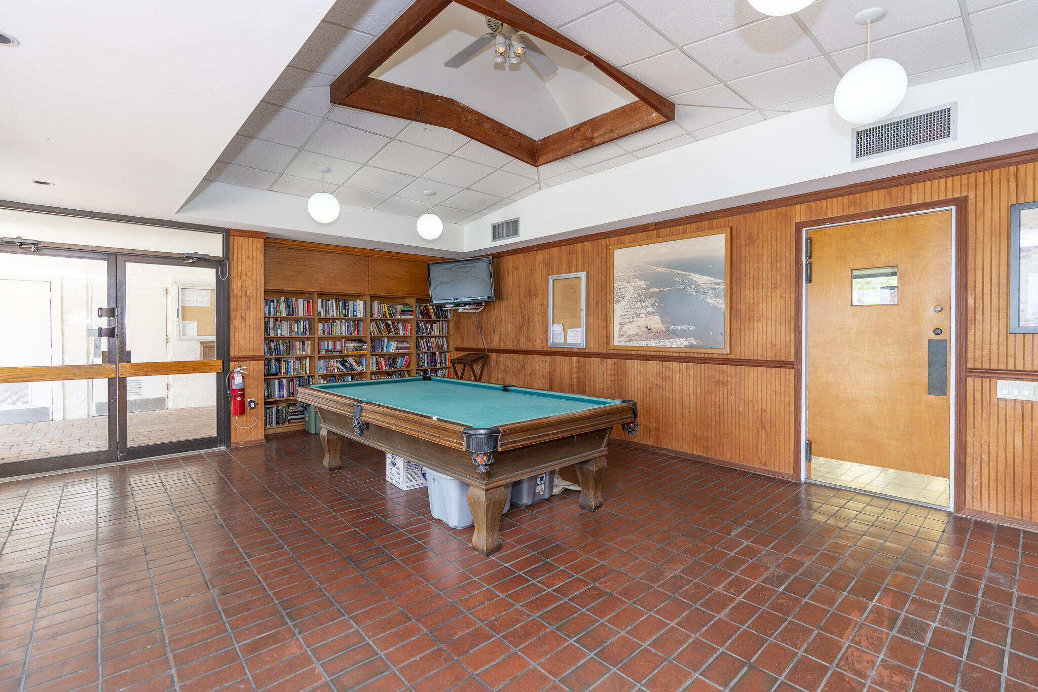 106 Half Moon Circle, Unit H2 Hypoluxo, FL 33462 - Photo 53 of 70 a room with pool table and windows