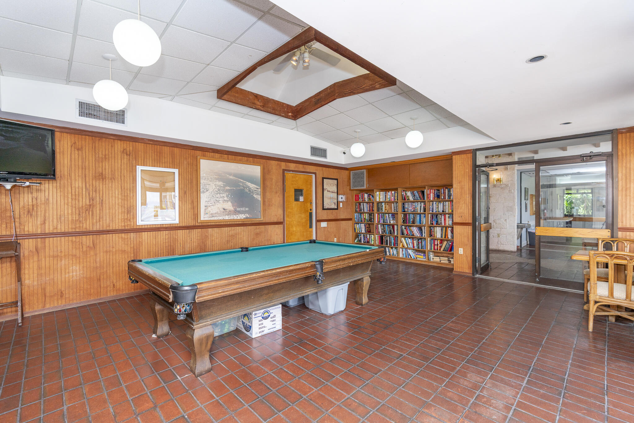 106 Half Moon Circle, Unit H2 Hypoluxo, FL 33462 - Photo 56 of 70 a room with furniture and wooden floor