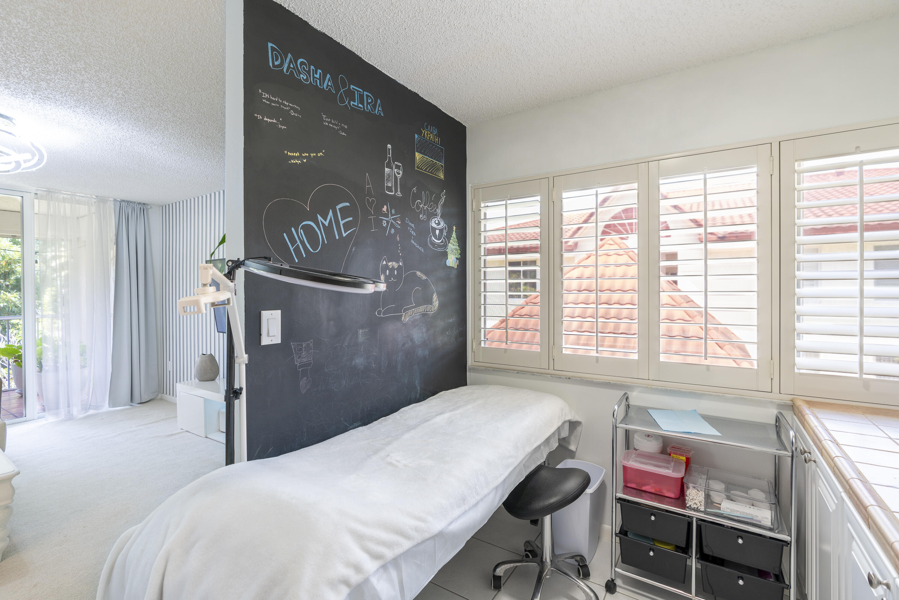 106 Half Moon Circle, Unit H2 Hypoluxo, FL 33462 - Photo 9 of 70 a bedroom with a bed and a dresser next to a window