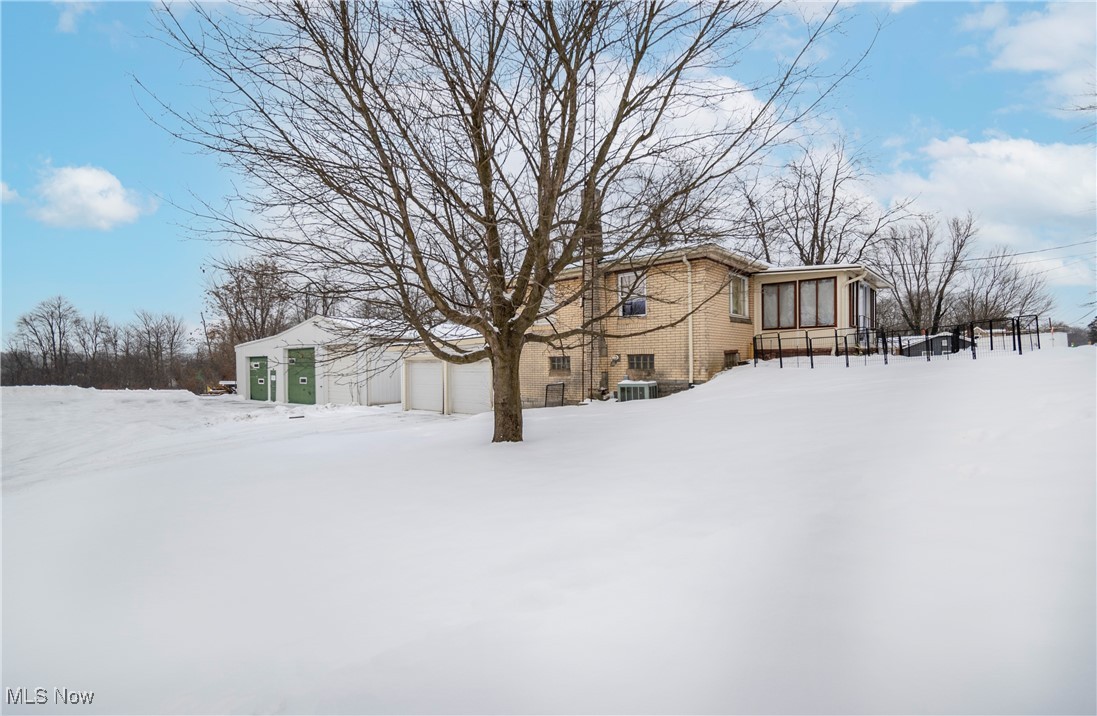 794 Benton Road Salem, OH 44460 - Photo 31 of 44 Yard layered in snow featuring a garage