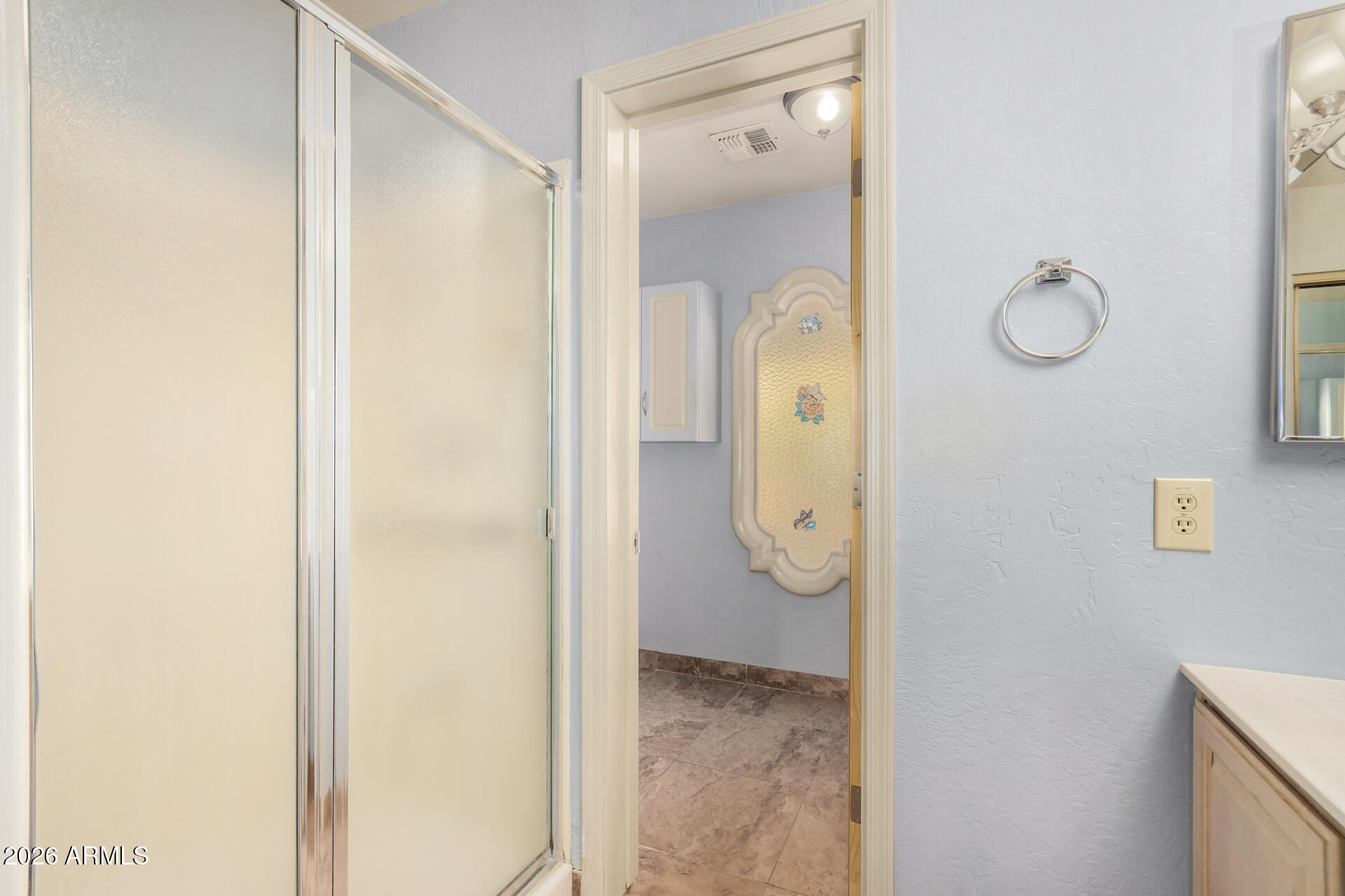 9152 West Redfield Road Peoria, AZ 85381 - Photo 13 of 21 a bathroom with a granite countertop shower mirror and a sink