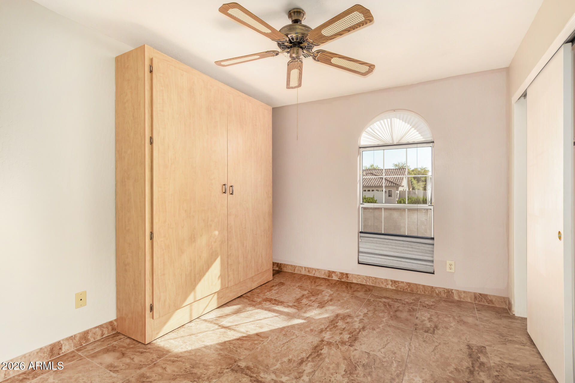 9152 West Redfield Road Peoria, AZ 85381 - Photo 14 of 21 a view of empty room with a ceiling fan