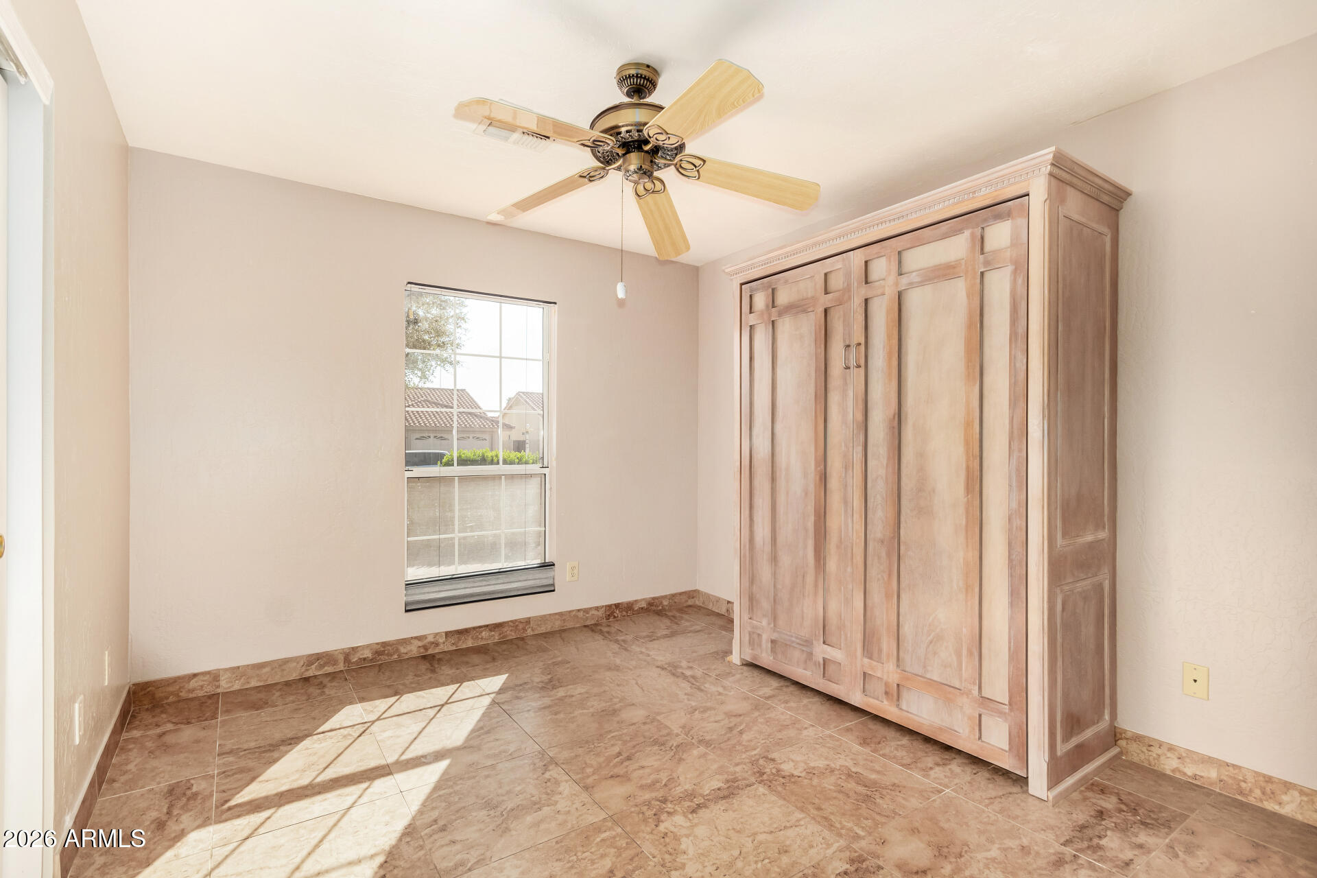 9152 West Redfield Road Peoria, AZ 85381 - Photo 15 of 21 a view of a livingroom with a ceiling fan and window
