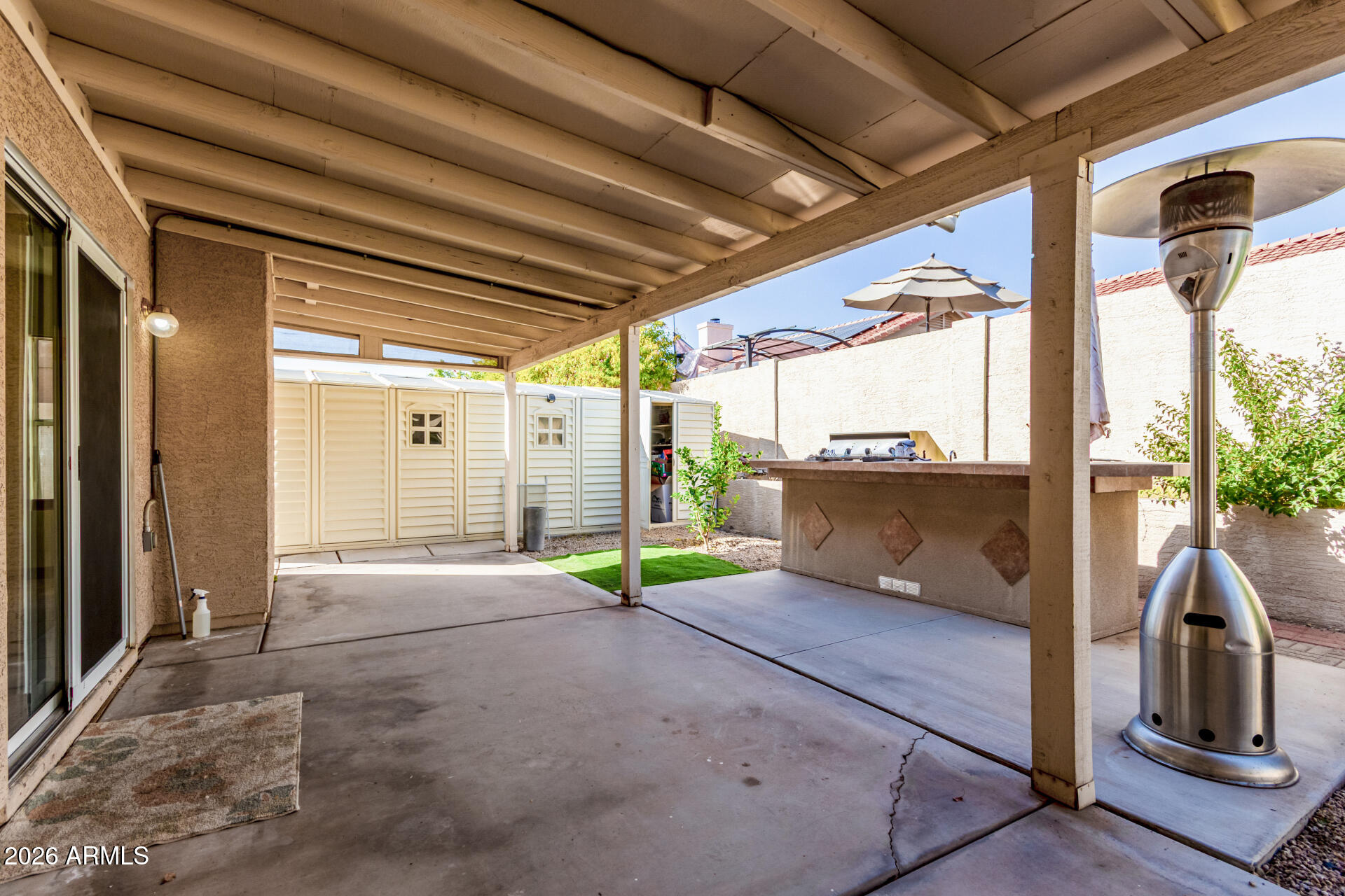 9152 West Redfield Road Peoria, AZ 85381 - Photo 17 of 21 a view of an empty room with wooden floor and windows
