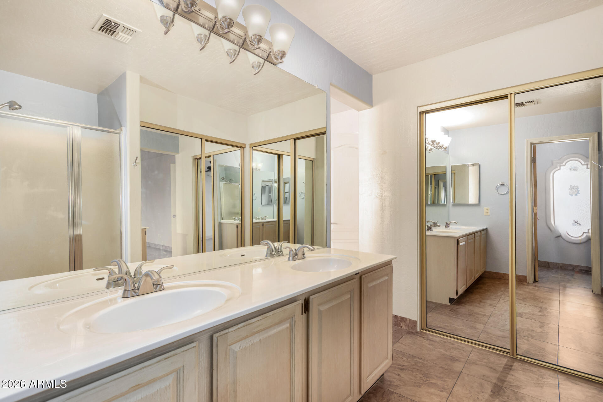 9152 West Redfield Road Peoria, AZ 85381 - Photo 5 of 21 a bathroom with a double vanity sink mirror and shower