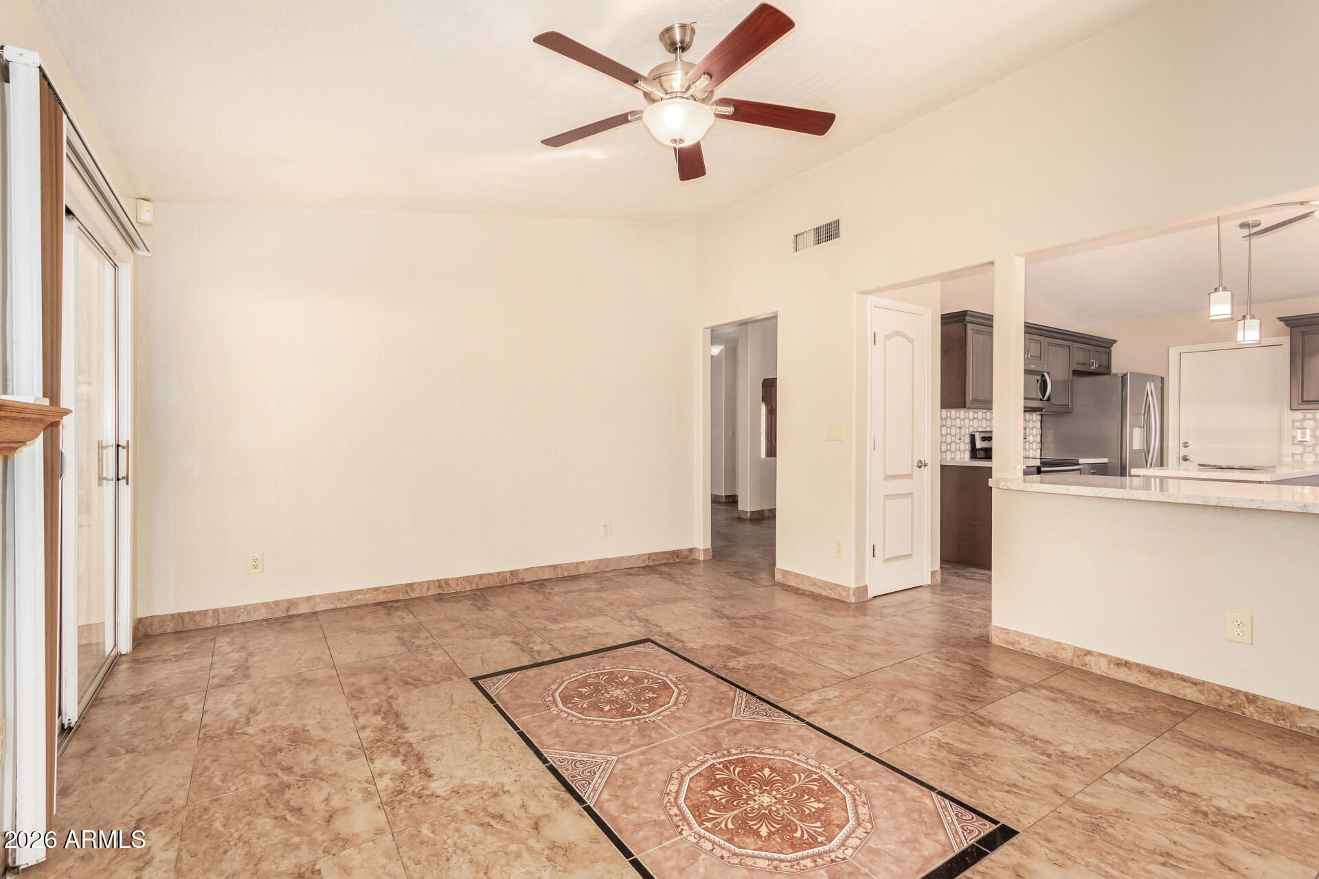 9152 West Redfield Road Peoria, AZ 85381 - Photo 7 of 21 a view of a kitchen with a sink and a refrigerator