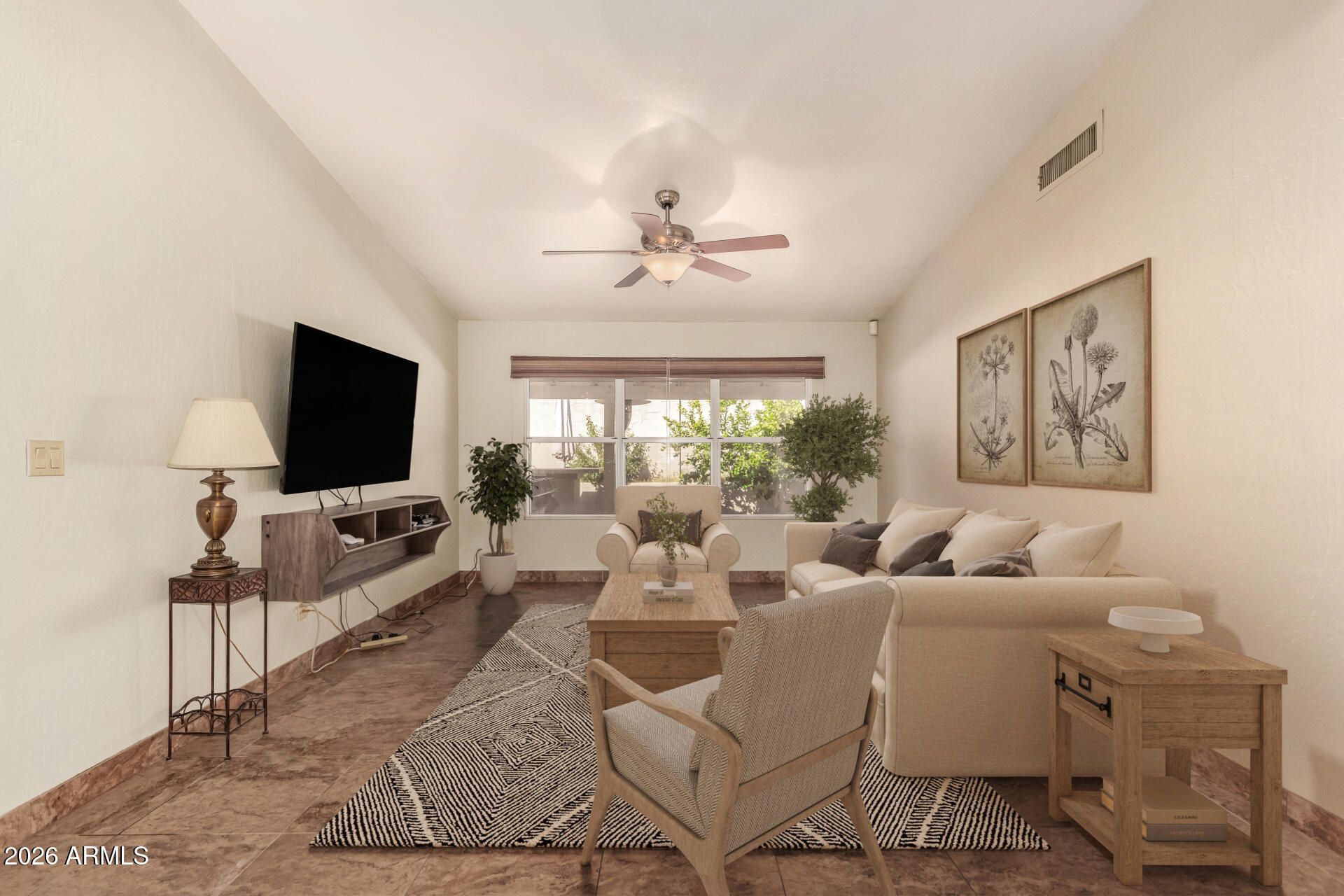 9152 West Redfield Road Peoria, AZ 85381 - Photo 10 of 21 a living room with furniture and a flat screen tv